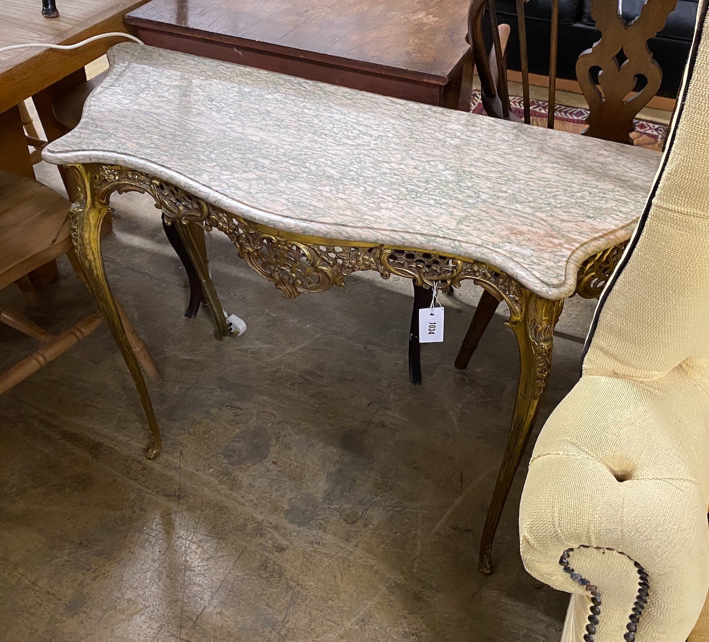 A cast brass console table with serpentine marble top, width 110cm, height 74cm